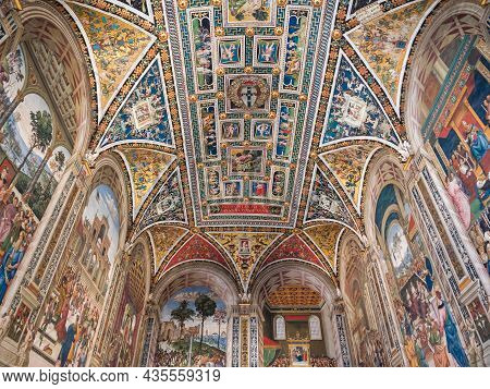 Siena, Italy - August 15 2021: Piccolomini Library Vault Ceiling Interior In Siena Cathedral With Fr