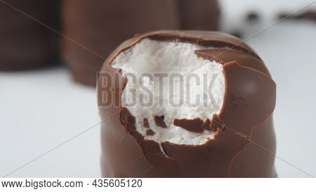White Chocolate Krembo On The Table. A Chocolate-coated Marshmallow Treat That Is Popular In Israel.