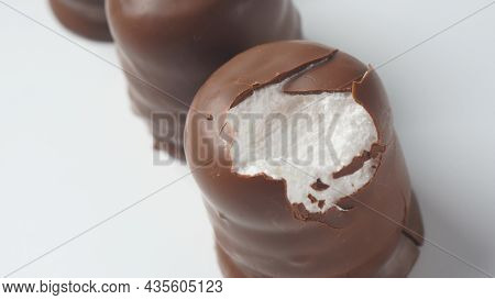 White Chocolate Krembo On The Table. A Chocolate-coated Marshmallow Treat That Is Popular In Israel.
