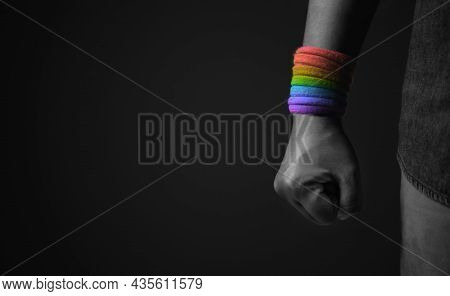 Power, Protest And Expression For Lgbtq, Rights Concept. Closeup Of Fist And Rainbow Wrist Strap. An