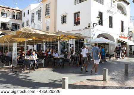Nerja -  Spain - September 22 2021 :  Tourists On The Costa Del Sol Relax In Bars And Restaurants In