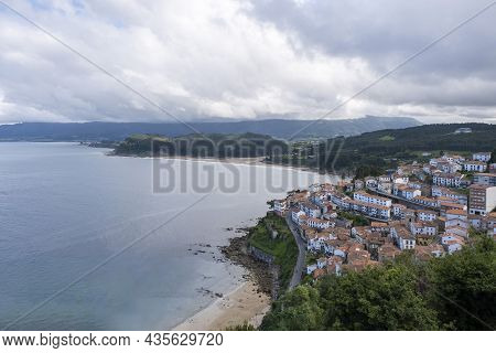 View Of The Fishing Village Of Lastres From The Viewpoint Of San Roque, With The Mountains Of Asturi