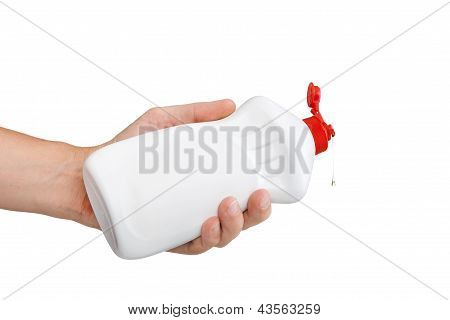 Hand with a detergent plastic bottle isolated on white background