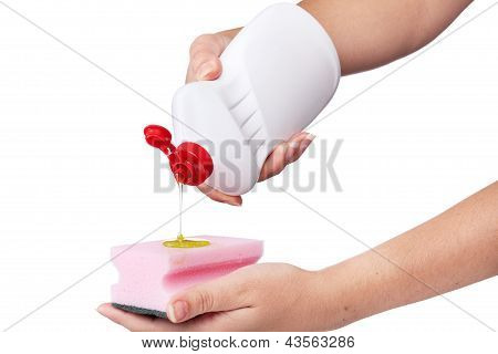 Hand with a detergent plastic bottle isolated on white background