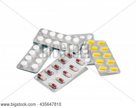 Pills On A White Background. Various Medicines In Blisters.