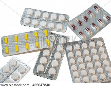 Pills On A White Background. Various Medicines In Packages.