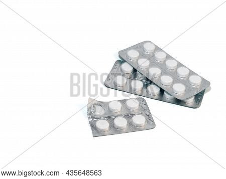 Pills On A White Background. Various Medicines In Packages.