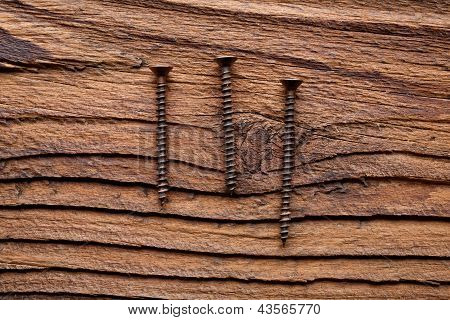 Three Screews on wood