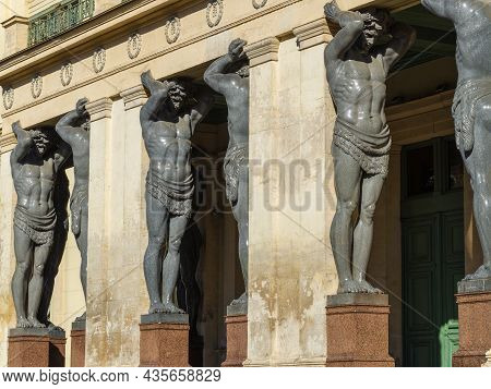 Saint Petersburg, Russia - July 17, 2021: Sculptures Of Atlanteans Holding The Portico Of The New He