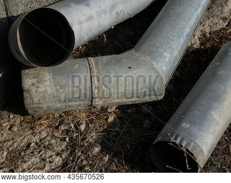 Gutter Components Falling Apart Near A Residential House, Conceptual Image Of Week Labour Force.