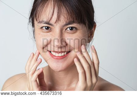Close Up Face, Young Asian Female Smiling With Water Drop On Her Face. Asian Woman Washing Face Clea