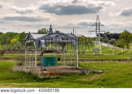 Comrat , Gagauzja, Republic Of Moldova - 02 May 2016: Well, A Water Intake Point Surrounded By A Bea