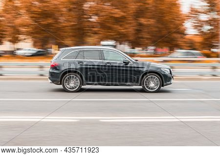 Moscow, Russia - October 2021: Side View Rolling Shot With Dusty Crossover Car In Motion. Mercedes G