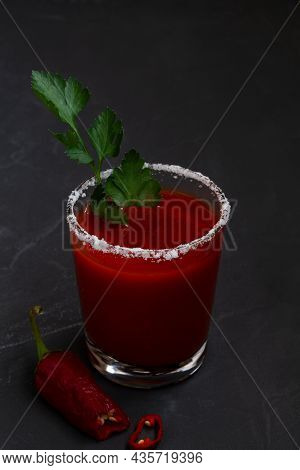 Tomato Juice With Pepper, Spices, Salt And Ice In Glass With Copy Space. Bloody Mary Cocktail. Alcoh