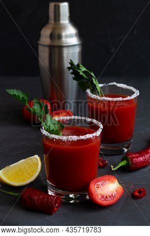 Tomato Juice And Basil With Pepper, Spices, Salt And Yellow Lemon In Glass With Copy Space. Bloody M