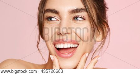 Skin Care. Woman With Beauty Face Touching Healthy Facial Skin Portrait. Beautiful Smiling Girl Mode