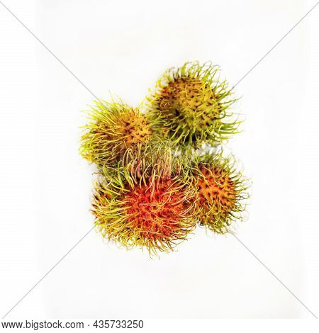 Rambutan An Exotic Tropical Fruit Lies On An Isolated Background
