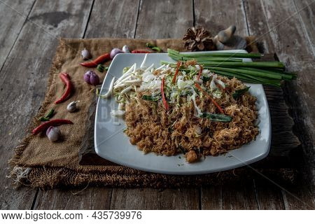 Asian Eating Food, Mee Grob Is An Sweet And Sour Crispy Noodles, Made From Thai Rice Noodle With Swe