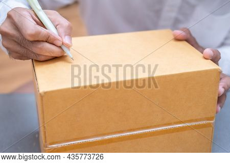 Asian Male Hand Writing Order Product List On Note For Online Customer In Warehouse Home Office Orde