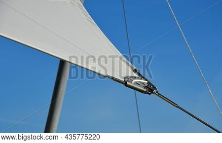 White Tarpaulin Taut, Shading From The Sun And Rain Over The Terrace Of The Restaurant, On The Playg