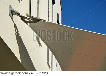 White Tarpaulin Taut, Shading From The Sun And Rain Over The Terrace Of The Restaurant, On The Playg