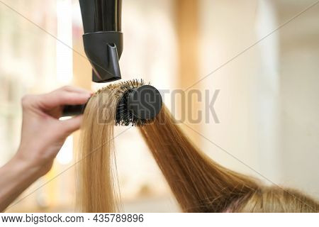 Repair Long Hair Procedure. Haircut At Salon. Woman Hairstyle. Master Hand With Brush And Fan. Adult