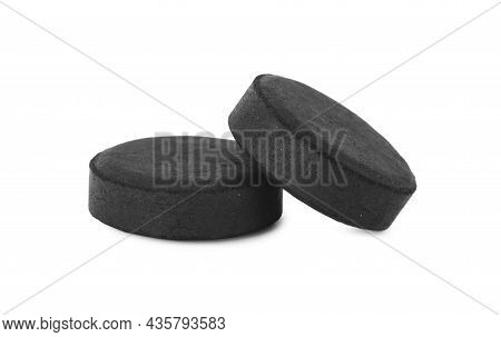 Activated Charcoal Pills On White Background. Potent Sorbent