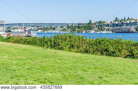 View Of Buildings Along Lake Union. Shot Taken From Gasworks Park In Seattle, Washington.