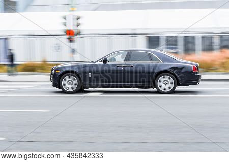 Black Rolls-royce Ghost Series I Fast Moving On Highway Road. Overspeed In City Concept.  Full-size 