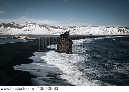 Dramatic Winter Landscape Of Icelandic Black Sand Beach Reynisfjara Near Town Vik. Stormy Sea Shore 
