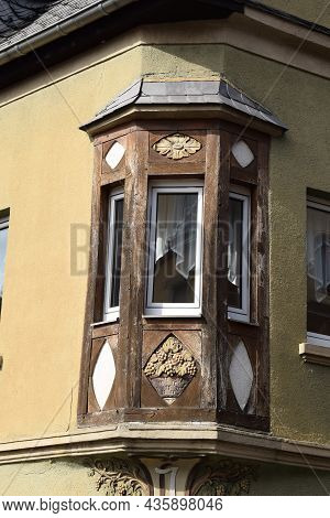 Treis-karden, Germany - 09 21 2021: Wooden Balcony On A Stone House