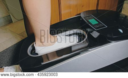 Automatic Thermal Shrinkable Shoe Cover Laminating Machine. Close Up. Machine Automatically Applies 