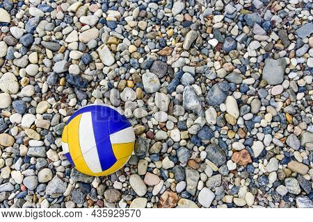 Vladivostok, Russia - Jule 7: Voleyball On The Beach. Collored Ball On The Pebble. Close-up. Copy Sp