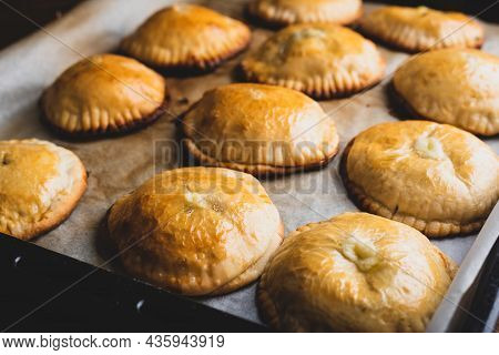 Oven Baked Hand Pies With Leek And Mushrooms On Baking Sheet
