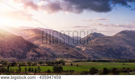 Canadian Mountain Landscape In The Desert Countryside Area. Sunset Sky Art Render. Near Osoyoos, Bri