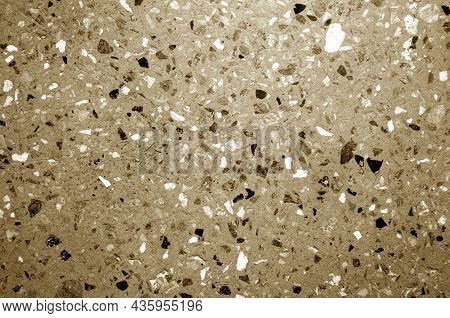 Cement Plate With Small Gravel Stones In Brown Tone. Abstract Background And Texture For Design.