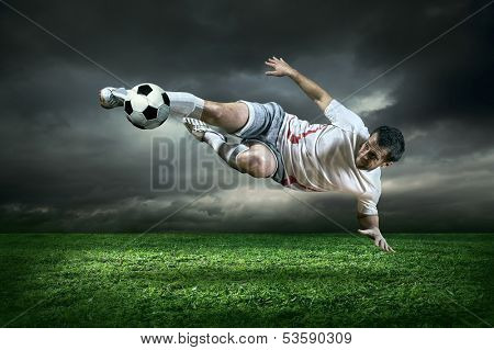 Football player with ball in action outdoors