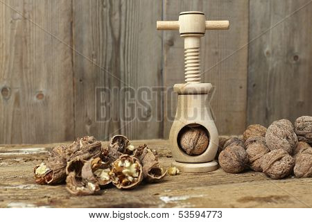 Walnuts Cracked Open With A Vintage Wooden Nut Cracker