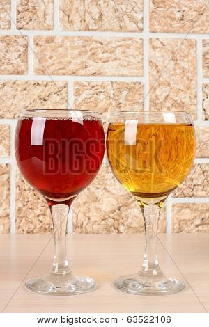 Wine bottle and glass on brick wall background
