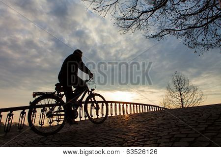 Silhouette Of A Man On Muontain-bike, Sunrise