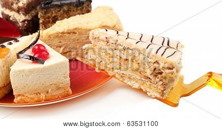 Assortment of pieces of cake, isolated on white