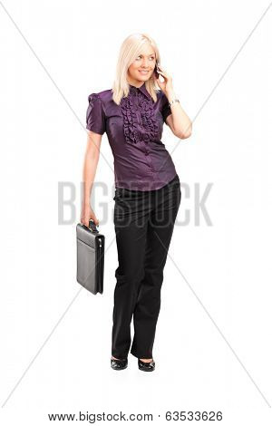 Full length portrait of a working woman talking on the phone isolated on white background