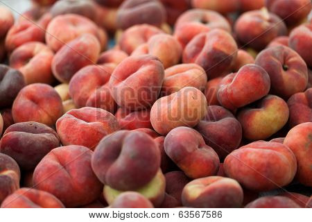 Close up of Saturn peach or chinese flat peaches