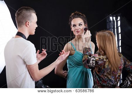 Phototograper, Make-up Artist And Model Working Together