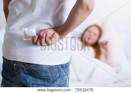 Man Holding Condom