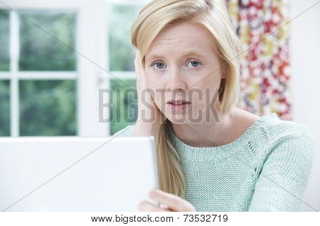Teenage Victim Of Online Bullying With Laptop
