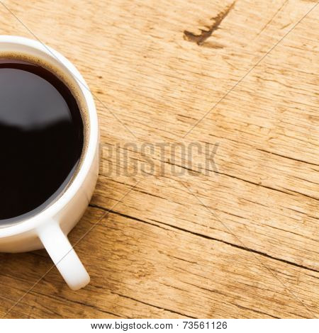 Coffee In White Ceramic Cup On Wooden Table - View From Top