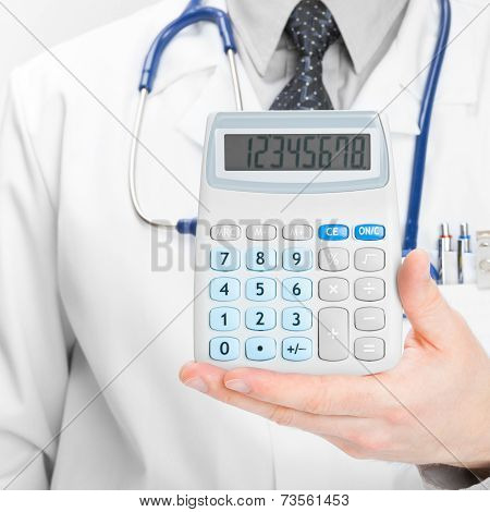 Doctor Holdling In His Hand Calculator - Heath Care Concept