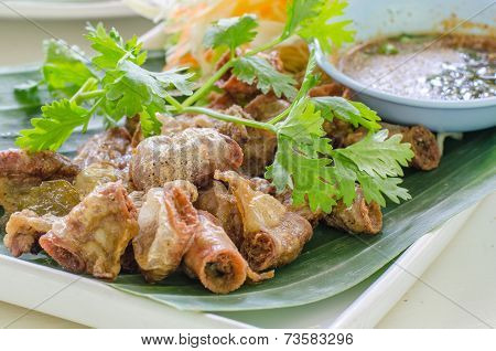 Chitterlings Fried Garlic On a dish and veg