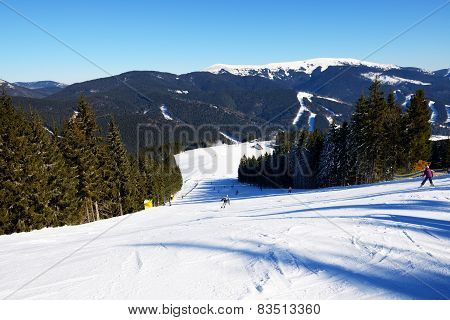 BUKOVEL, UKRAINE - FEBRUARY 17: The skiers are on a slope in Bukovel. It is the largest ski resort i